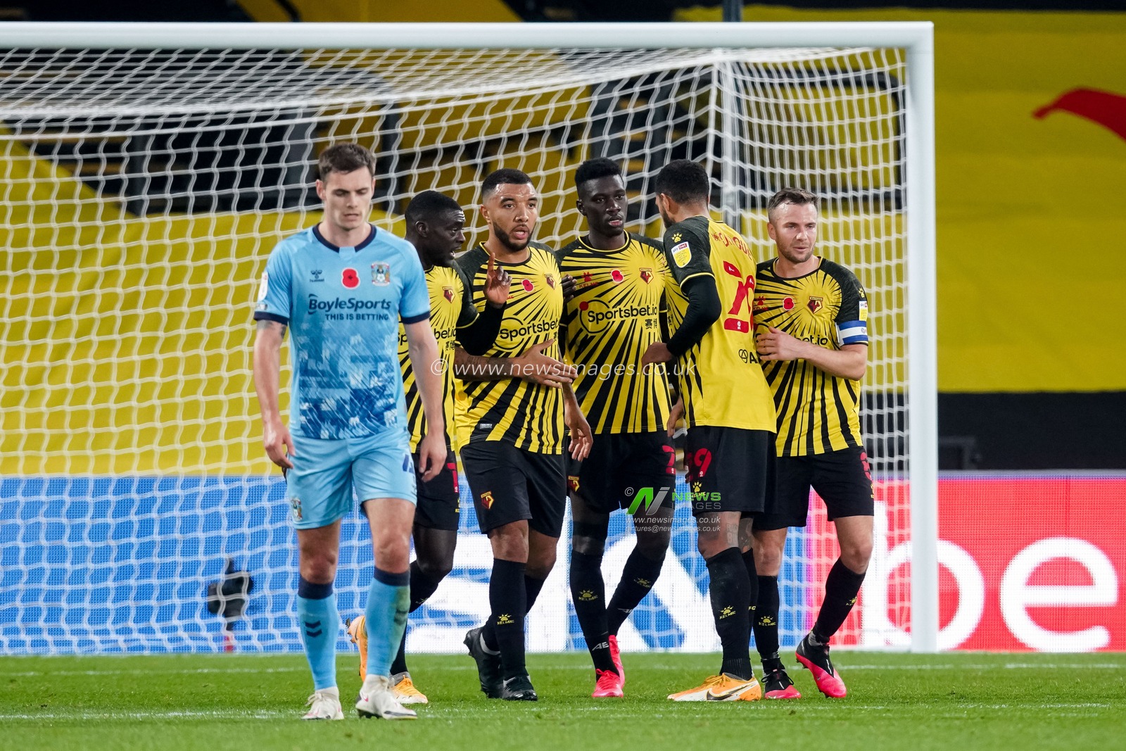 Ismaila Sarr #23 of Watford celebrates with his team mates after scoring from the penalty spot to win the game 3:2