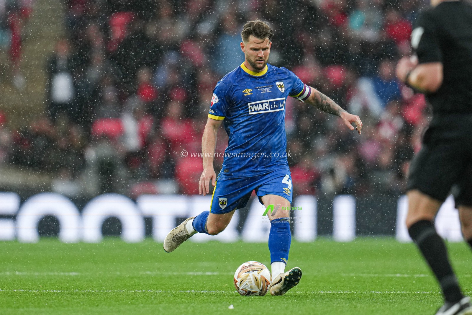Jake Reeves of AFC Wimbledon on the ball during the Sky Bet League 2 Playoff Final match AFC Wimbledon vs Walsall at Wembley Stadium, London, United Kingdom, 26th May 2025

(Photo by Harvey Murphy/News Images)