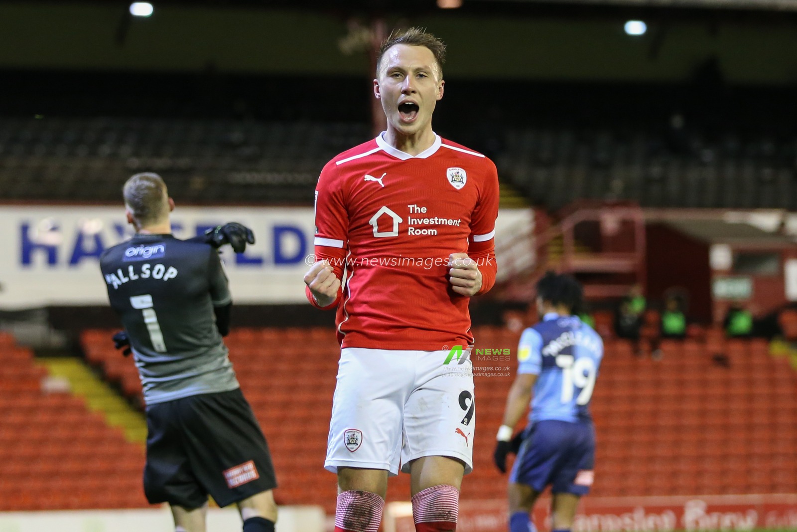 celebration Cauley Woodrow #9 of Barnsley celebrates his goal to make it 2-1