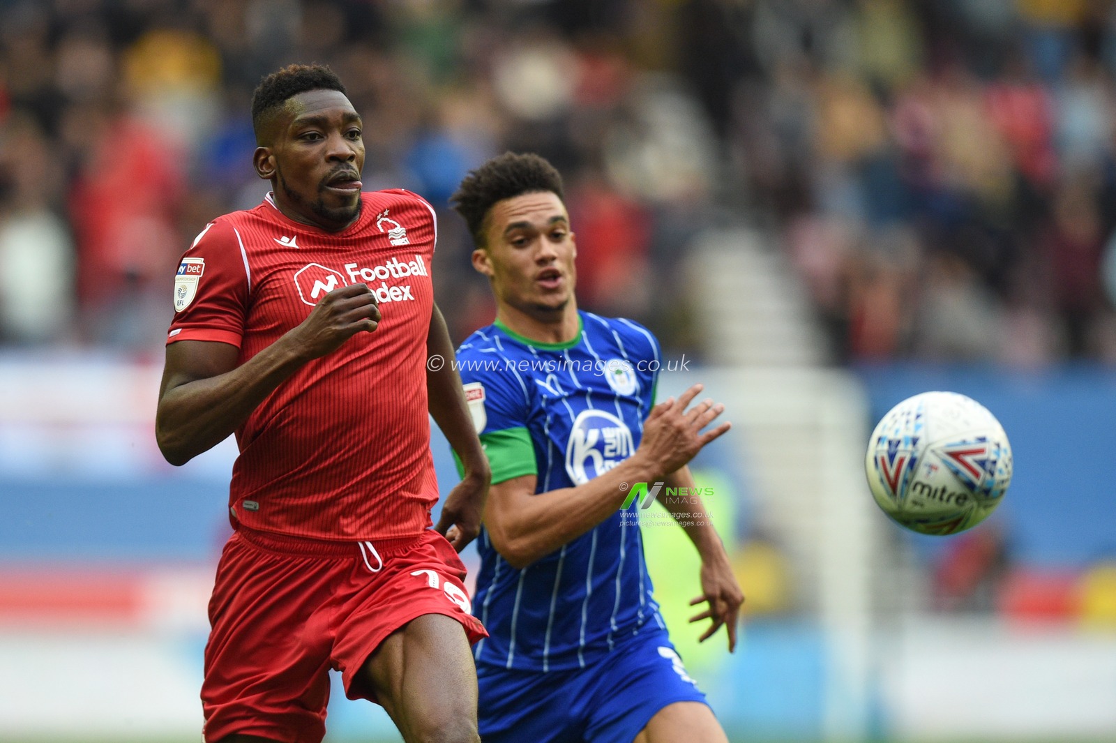20th October 2019, DW Stadium, Wigan, England; Sky Bet Championship, Wigan Athletic v Nottingham Forest : Sammy Ameobi (19) of Nottingham Forest and Charlie Mulgrew (16) of Wigan Athletic chase down the ball

Credit: Richard Long/News Images