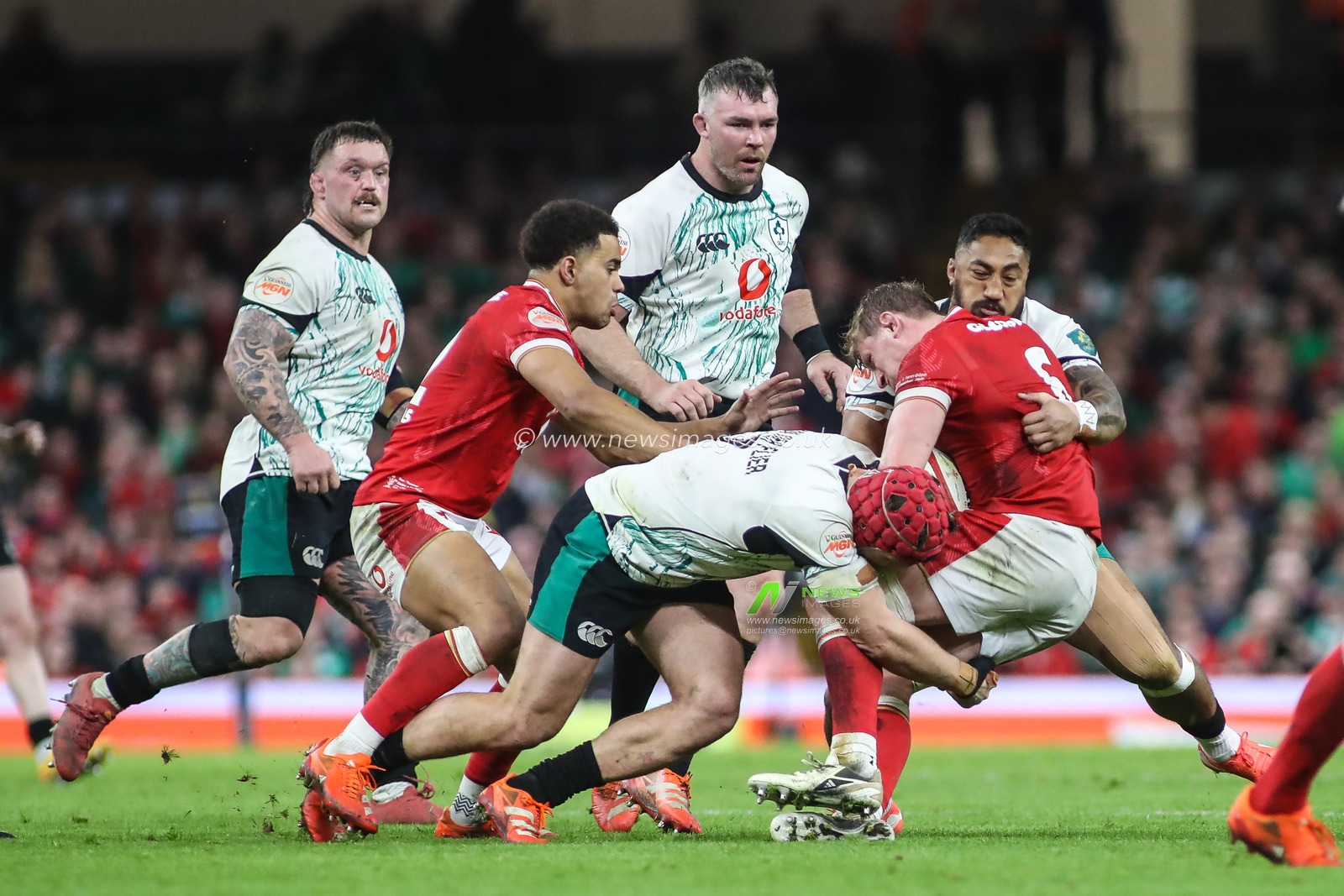Jac Morgan of Wales is tackled by Josh van der Flier and Bundee Aki of Ireland during the 2025 Guinness 6 Nations match Wales vs Ireland at Principality Stadium, Cardiff, United Kingdom, 22nd February 2025

(Photo by Andrew Lewis/News Images)