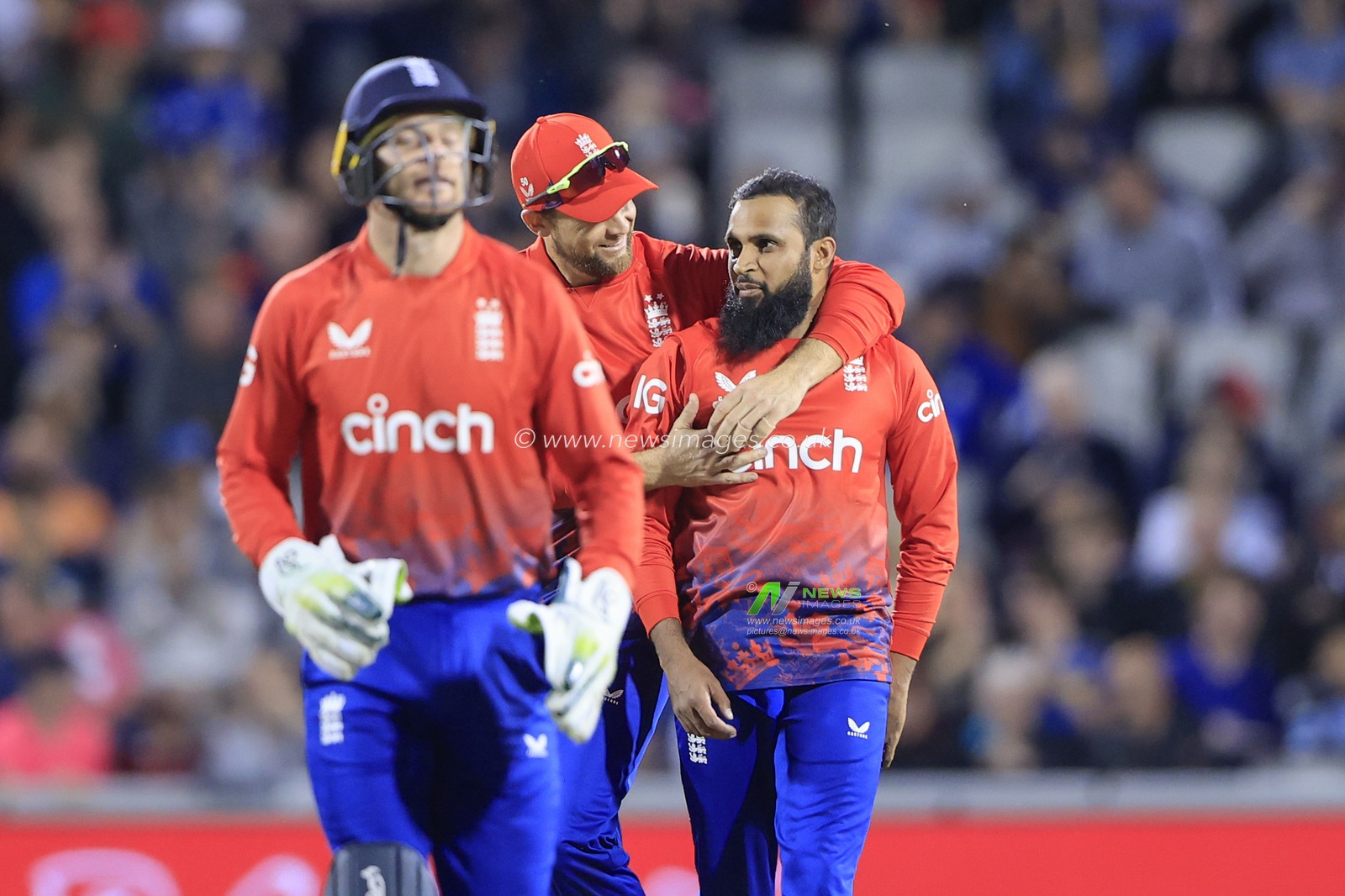 Adil Rashid #95 of England is congratulated after taking the wicket of Glenn Phillips #23 of New Zealand during the Second Vitality T20 International match England vs New Zealand at Old Trafford, Manchester, United Kingdom, 1st September 2023

(Photo by Conor Molloy/News Images)