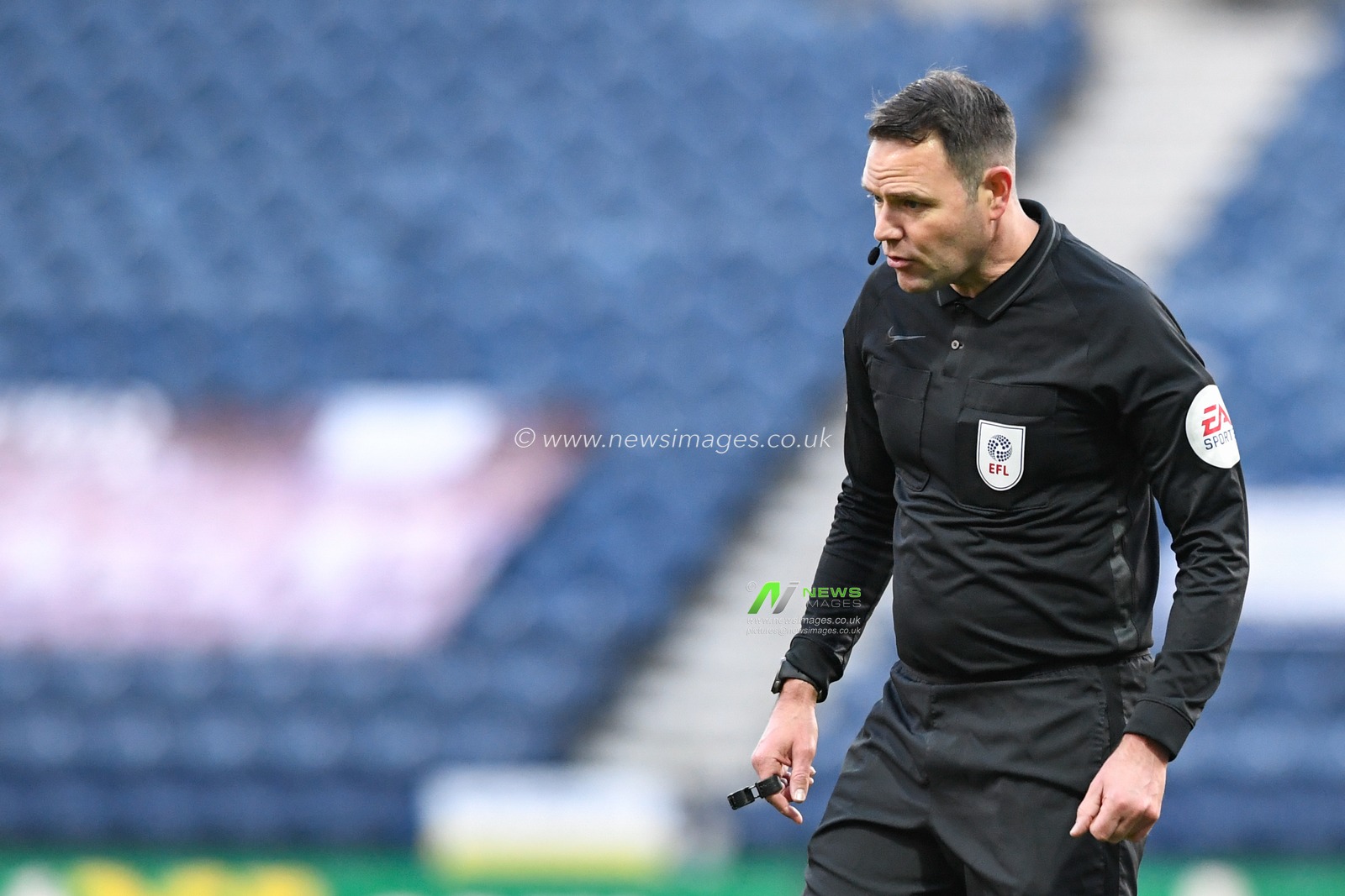 Referee James Linington in action during the game