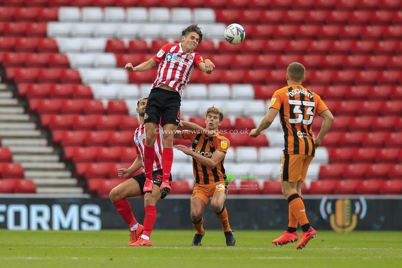 George Dobson (8) of Sunderland heads the ball