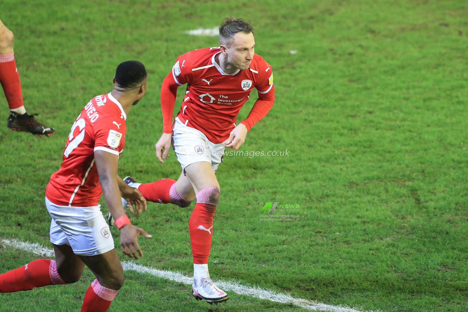 Cauley Woodrow #9 of Barnsley celebrates his goal to make it 2-0