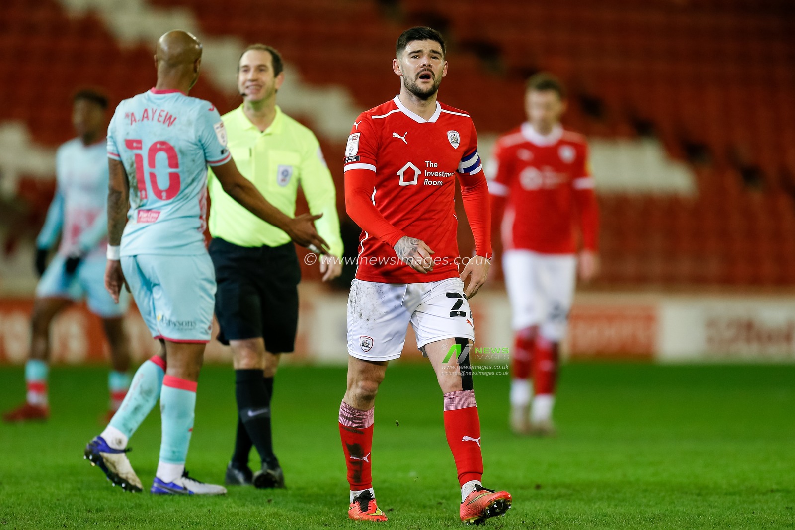 Alex Mowatt #27 of Barnsley walks off the pitch at half time