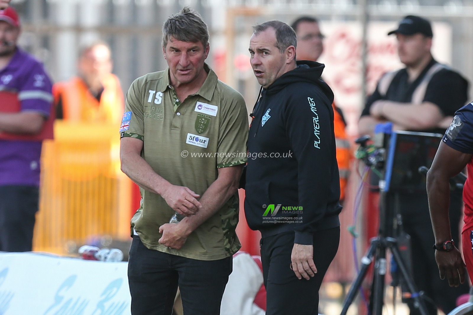Tony Smith Head Coach of Hull KR and Ian Watson Head Coach of Huddersfield Giants in discussion at the end of the match