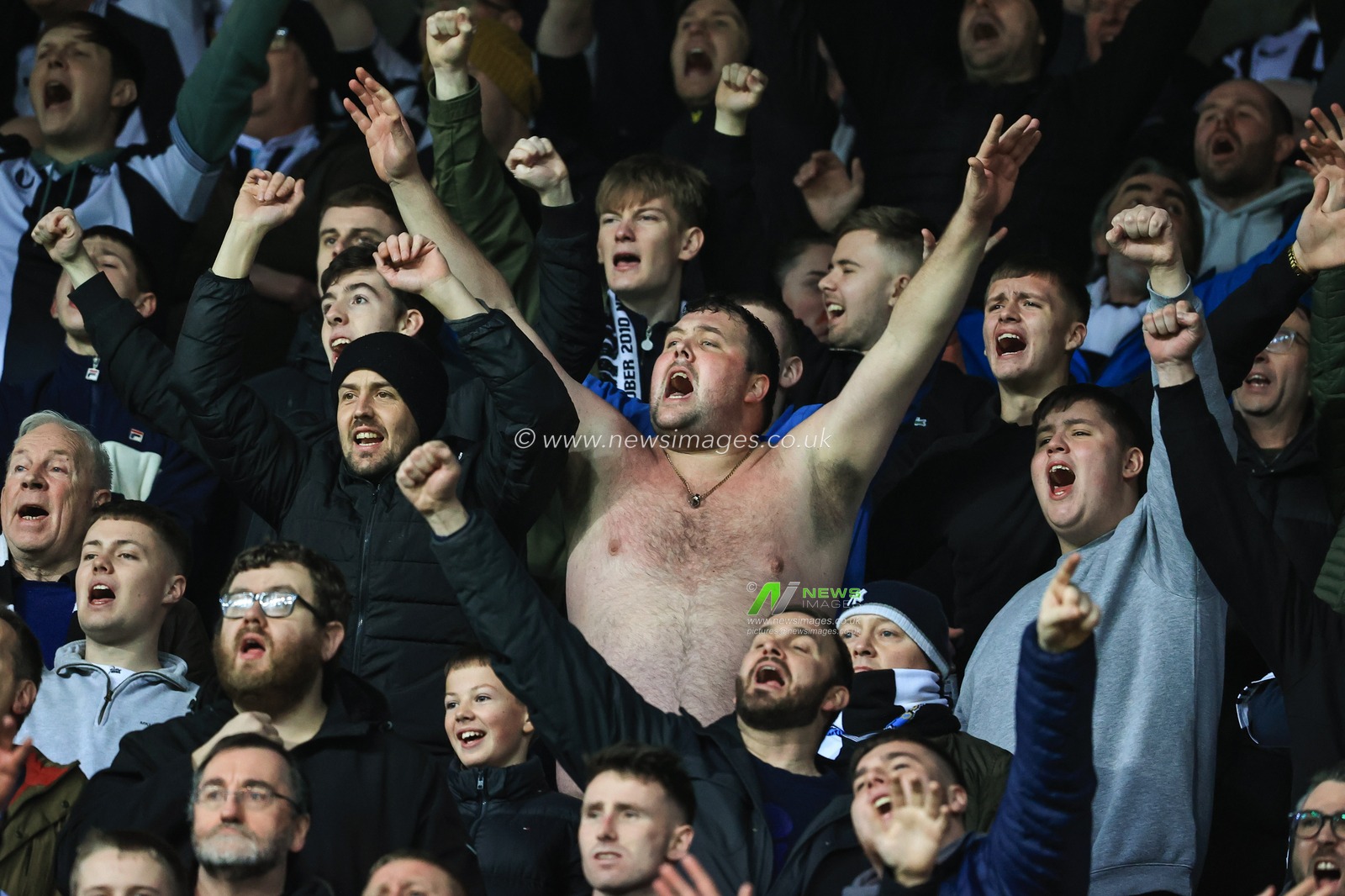 Newcastle United fans singing during the game