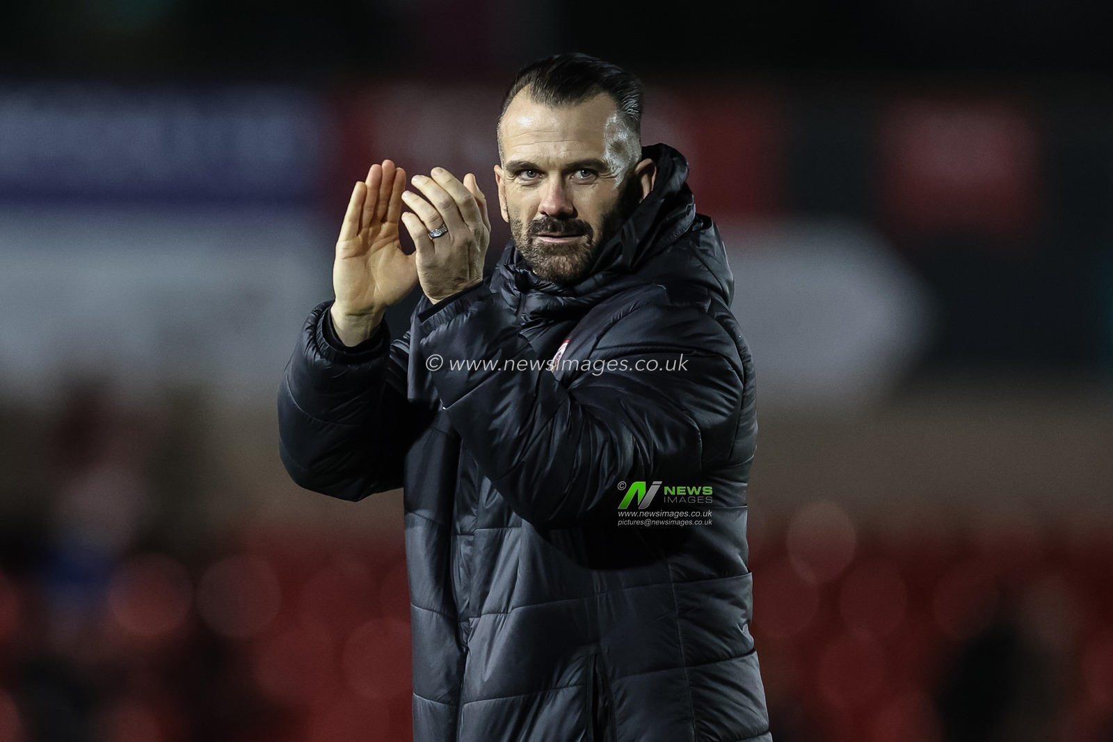 Martin Devaney first team coach of Barnsley applauds the travelling fans during the Sky Bet League 1 match Lincoln City vs Barnsley at Gelder Group Sincil Bank Stadium, Lincoln, United Kingdom, 25th November 2023

(Photo by Mark Cosgrove/News Images)
