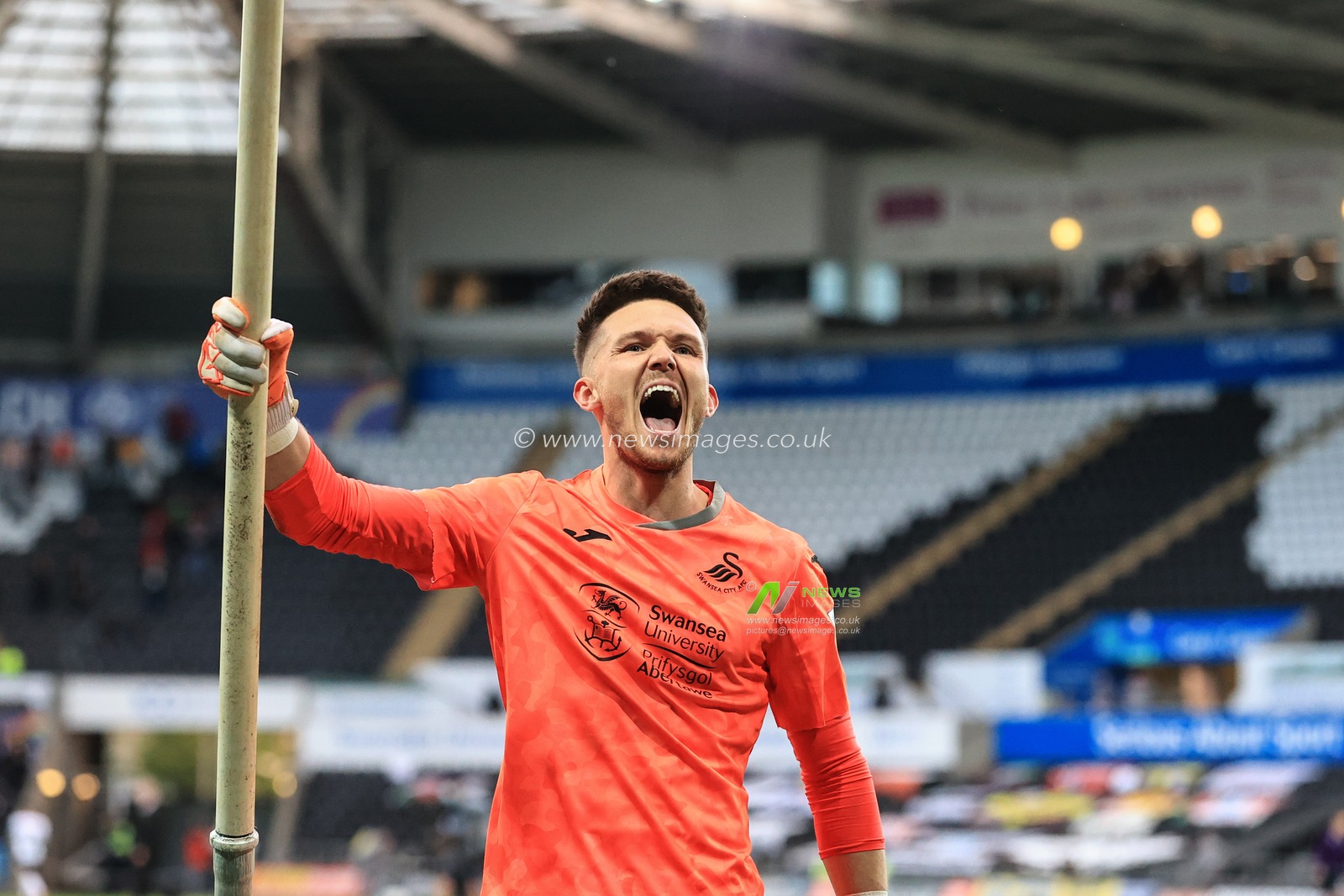 Freddie Woodman #1 of Swansea City celebrates Swanseaâ€™s win over Barnsley and booking their place at Wembley in the Championship playoff final with Brentford