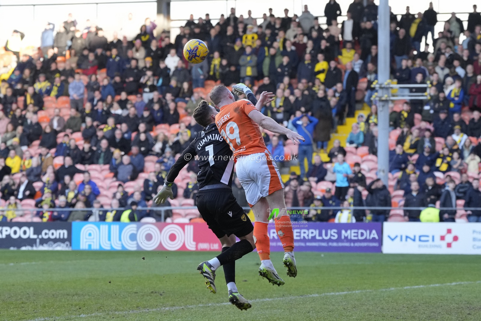 Shayne Lavery of Blackpool competes for the ball with Jamie Cumming of Oxford United during the Sky Bet League 1 match Blackpool vs Oxford United at Bloomfield Road, Blackpool, United Kingdom, 10th February 2024

(Photo by Steve Flynn/News Images)