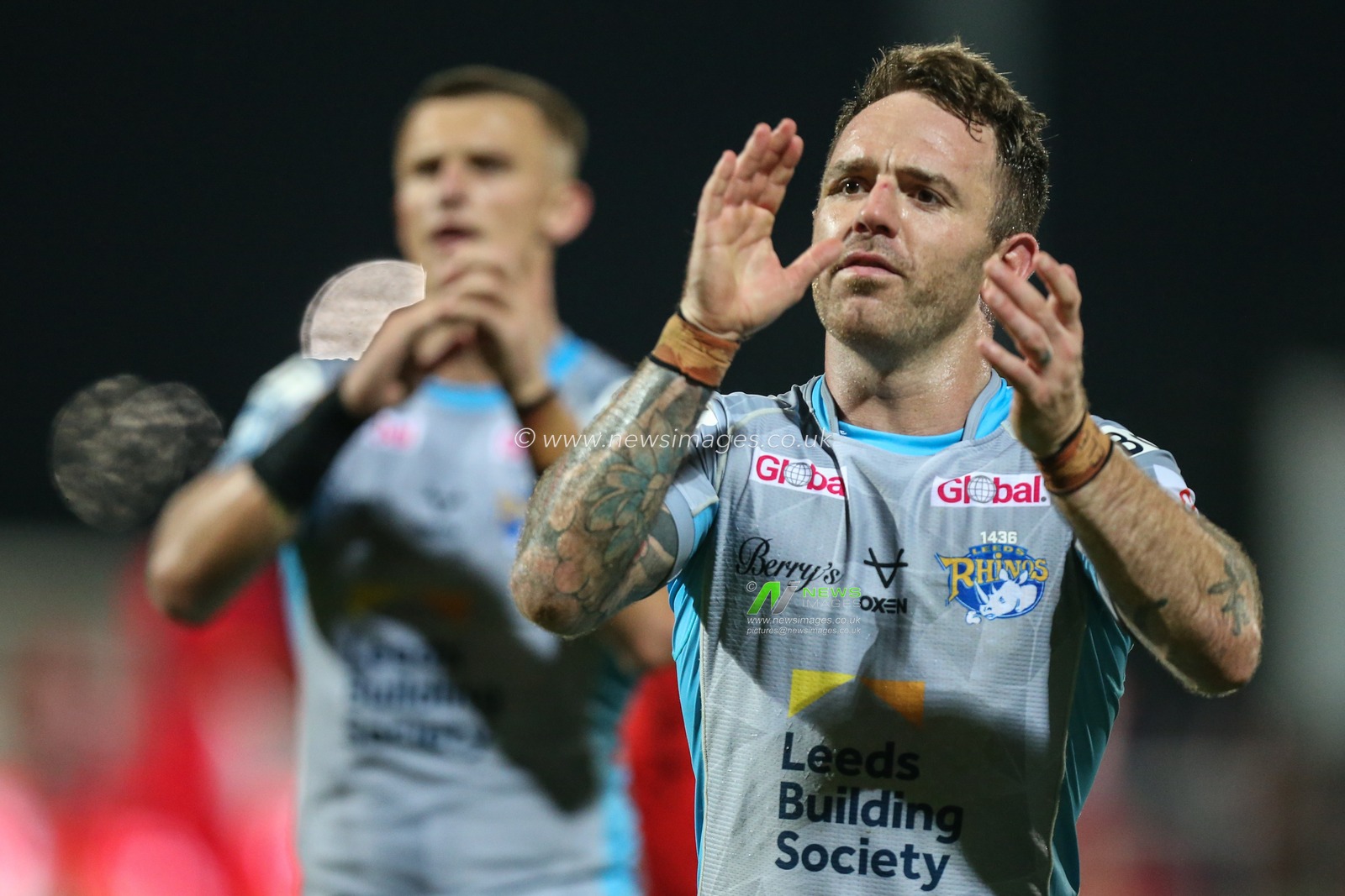 Richie Myler #16 of Leeds Rhinos applauds the travelling Leeds fans