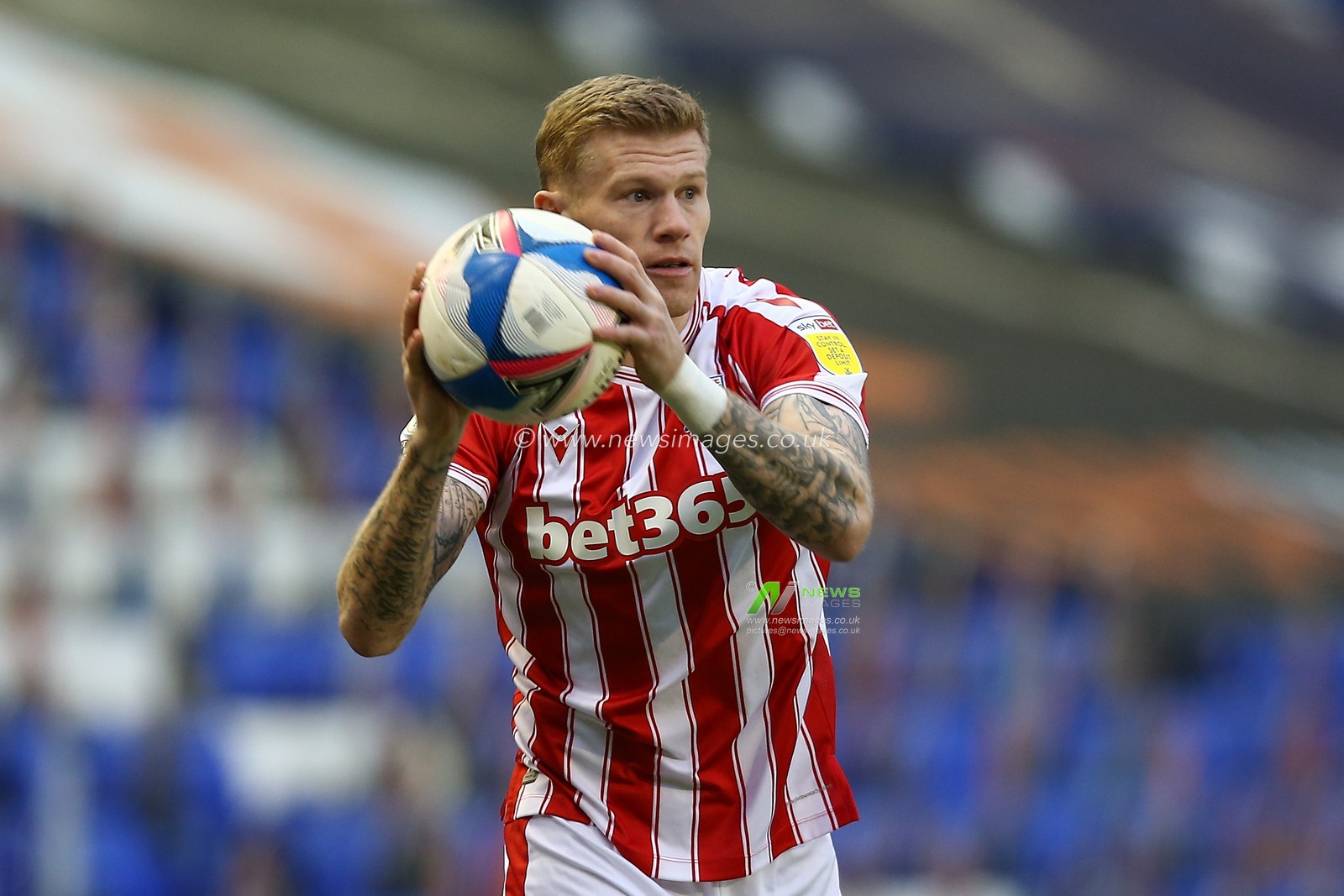 James McClean #11 of Stoke City takes a throw in