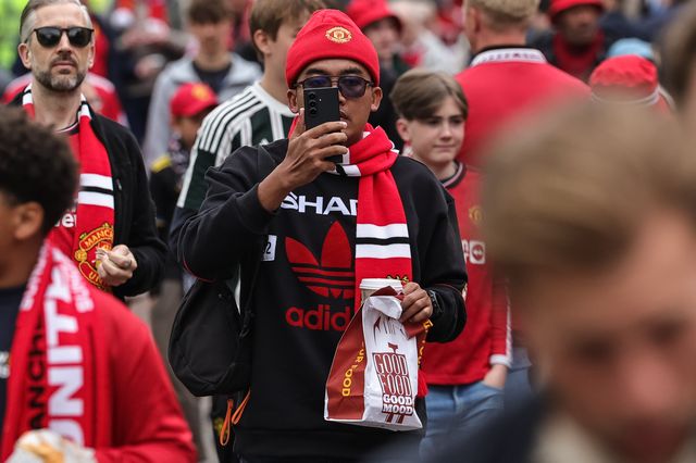 Manchester United fans make their way to the game during the Premier League match Manchester United vs Liverpool at Old Trafford, Manchester, United Kingdom on 03 May 2026

(Photo by Mark Cosgrove/News Images)