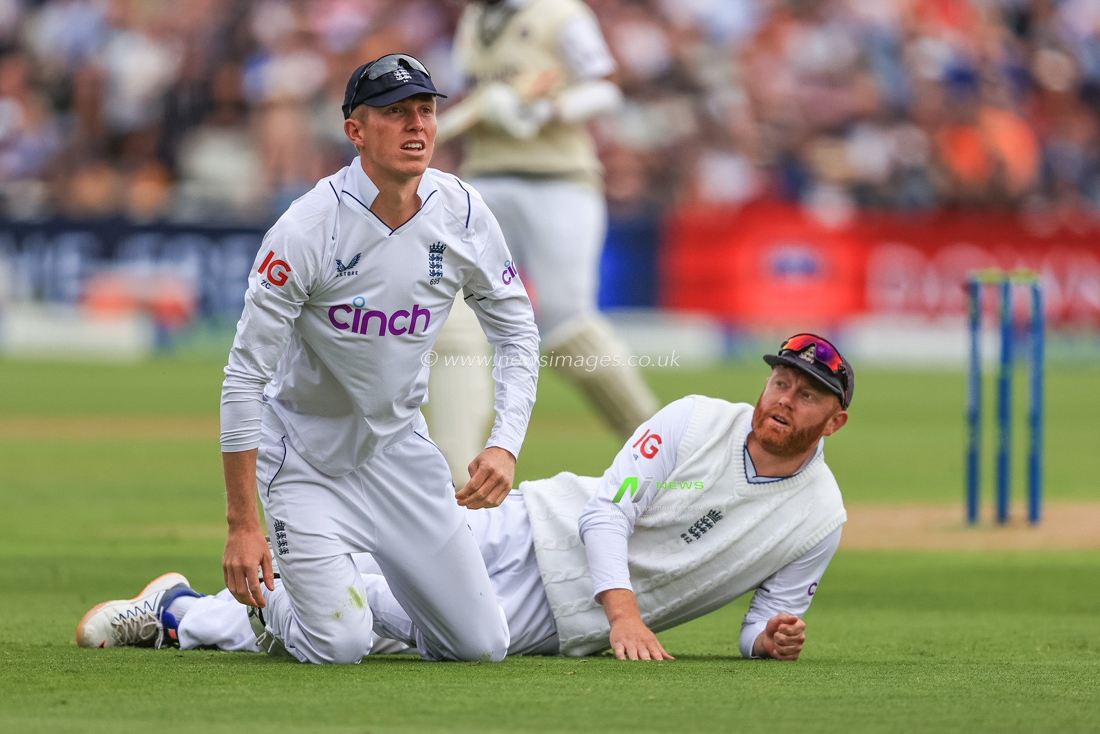 Jonny Bairstow of England looks up to Zak Crawley of England as he drops the ball from Hanuma Vihari of India