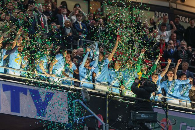 Manchester City players lift the trophy after the final whistle during the Carabao Cup Final match Arsenal vs Manchester City at Emirates, London, United Kingdom on 22 March 2026

(Photo by Alfie Cosgrove/News Images)