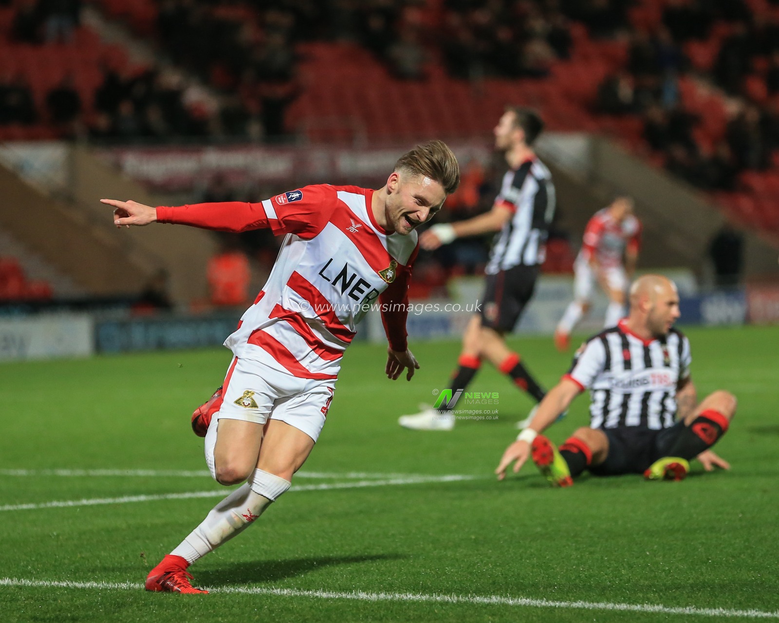 20th November 2018, Keepmoat Stadium, Doncaster, England; The Emirates FA Cup, Round 1, Doncaster Rovers v Chorley ;  Alfie May (19) of Doncaster celebrate his goal after making it 4-0

Credit: Mark Cosgrove/News Images

English Football League images are subject to DataCo Licence