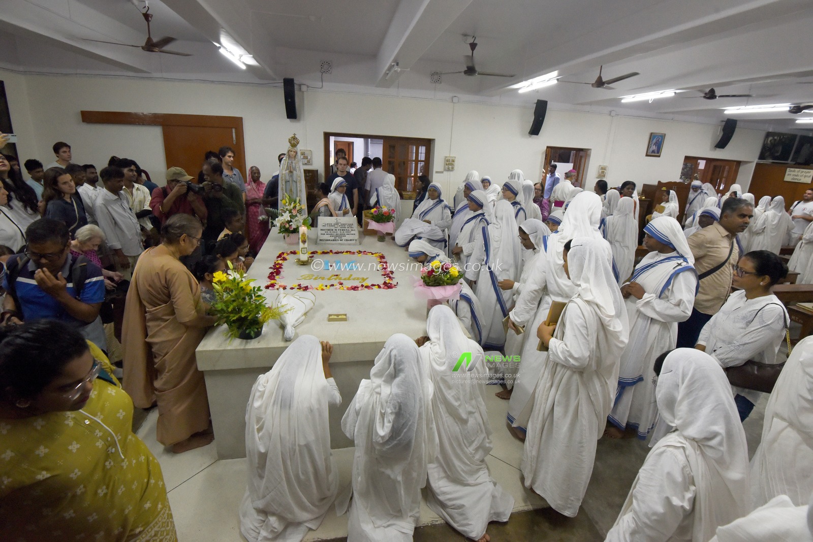 Nuns of the Missionaries of Charity, the order founded by Saint Teresa of Kolkata, pray at her tomb on the saint’s 116th birth anniversary at the Mother House in Kolkata, India, Wednesday, August 26, 2026.Photo by Debajyoti Chakraborty(Photo: Debajyoti Chakraborty/News Images)