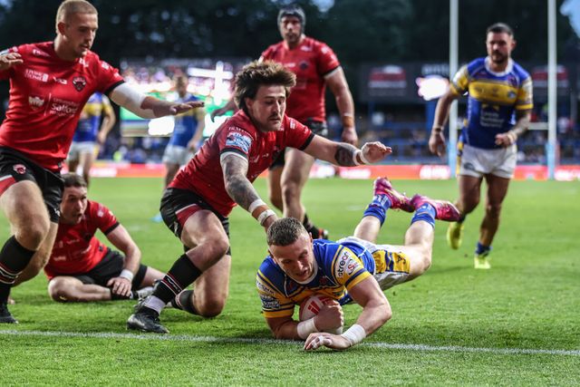 Harry Newman of Leeds Rhinos goes over for a try during the Betfred Super League round 19 match Leeds Rhinos vs Salford Red Devils at Headingley Stadium, Leeds, United Kingdom, 18th July 2025

(Photo by Alfie Cosgrove/News Images)
