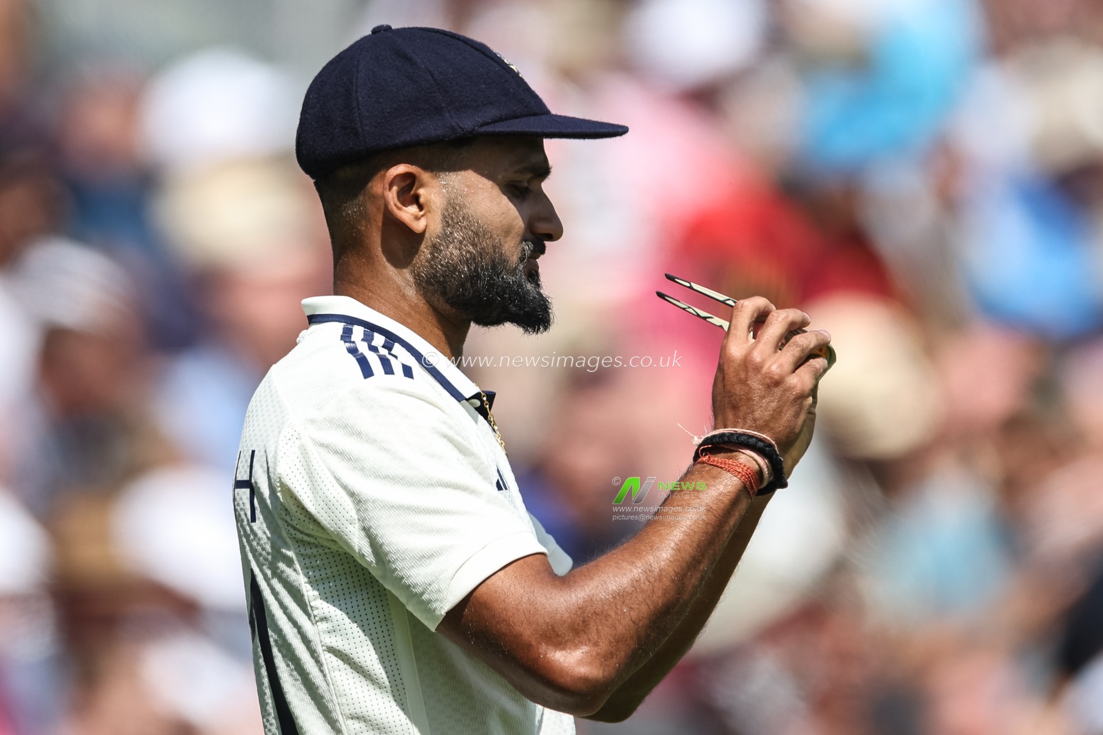 Akash Deep of India cleans his sunglasses during the 2nd Rothesay Test Match day 3 England v India at Edgbaston, Birmingham, United Kingdom, 4th July 2025

(Photo by Mark Cosgrove/News Images)