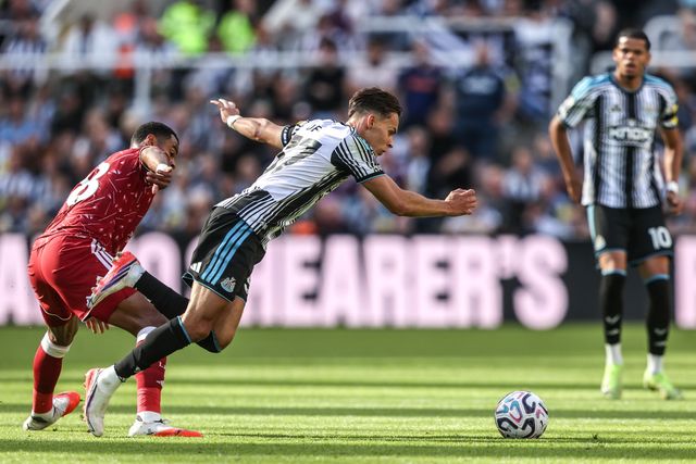Amar Dedić of Newcastle United is fouled by Cody Gakpo of Liverpool during the Premier League match Newcastle Untied vs Liverpool at St. James's Park, Newcastle, United Kingdom on 23 August 2026

(Photo by Alfie Cosgrove/News Images)