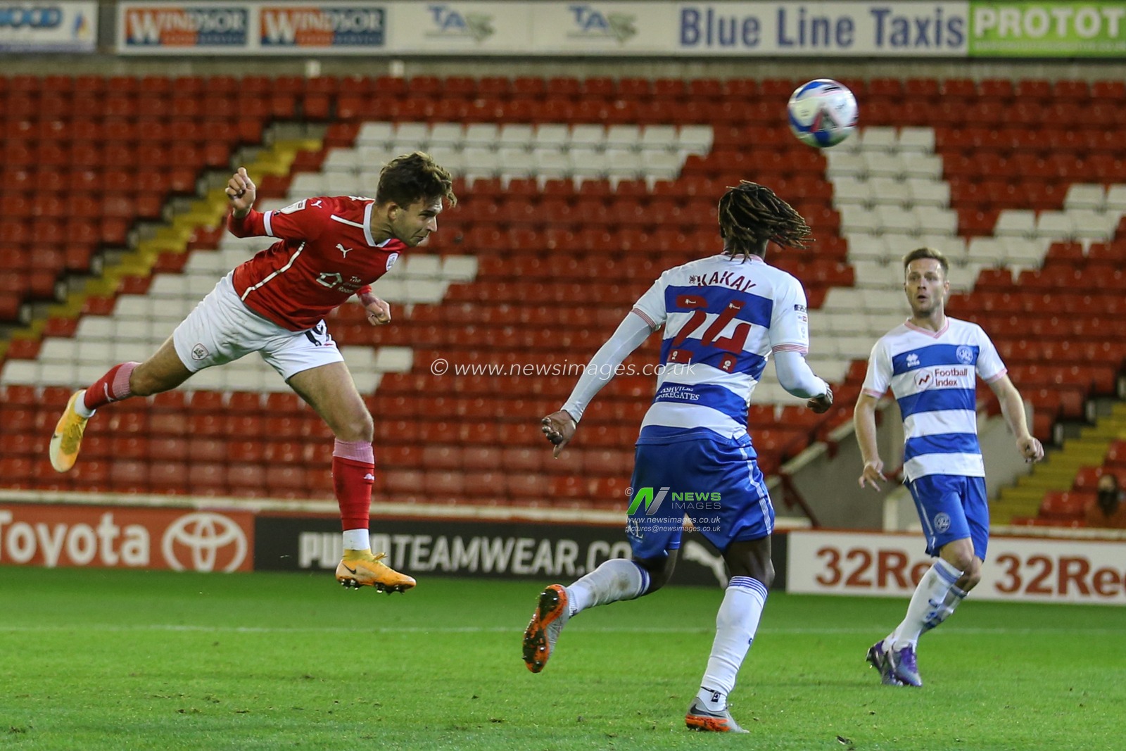Patrick Schmidt (19) of Barnsley heads the ball towards goal