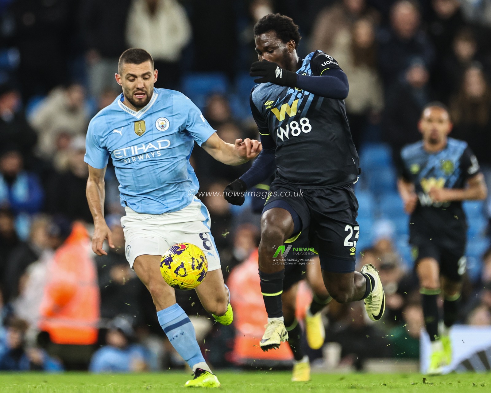 Datro Fofana of Burnley breaks with the ball during the Premier League match Manchester City vs Burnley at Etihad Stadium, Manchester, United Kingdom, 31st January 2024

(Photo by Mark Cosgrove/News Images)