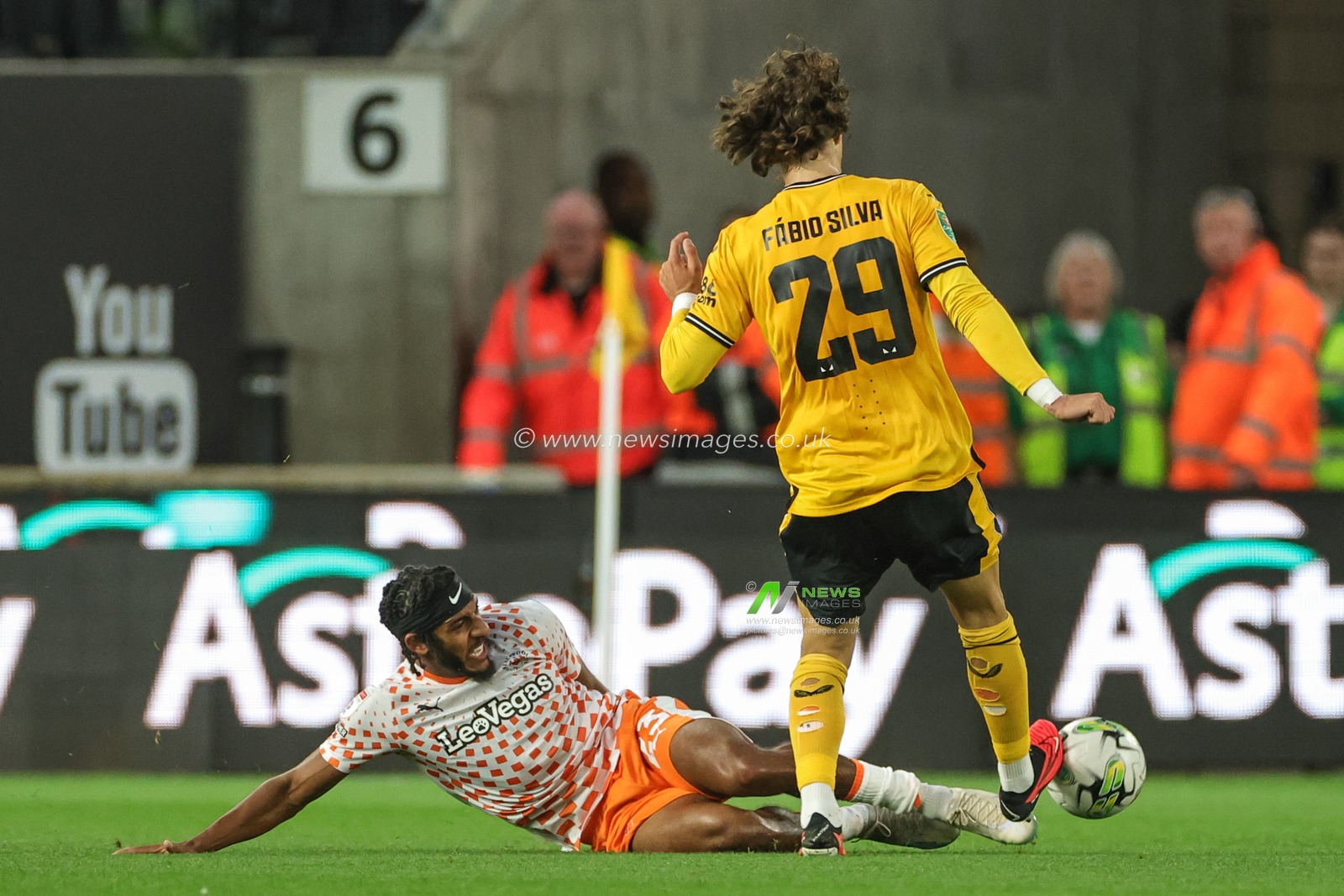 Dominic Thompson #23 of Blackpool slides in to win the ball from FÃ¡bio Silva #29 of Wolverhampton Wanderers during the Carabao Cup match Wolverhampton Wanderers vs Blackpool at Molineux, Wolverhampton, United Kingdom, 29th August 2023

(Photo by Mark Cosgrove/News Images)