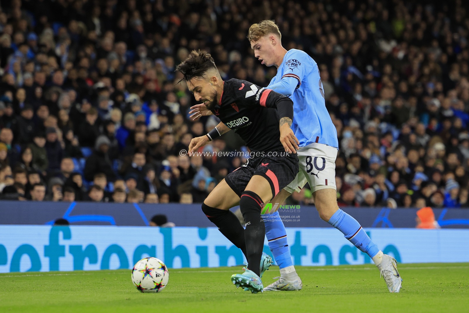 Alex Telles #3 of Sevilla tries to hold off Cole Palmer #80 of Manchester City during the UEFA Champions League match Manchester City vs Sevilla at Etihad Stadium, Manchester, United Kingdom, 2nd November 2022

(Photo by Conor Molloy/News Images)
