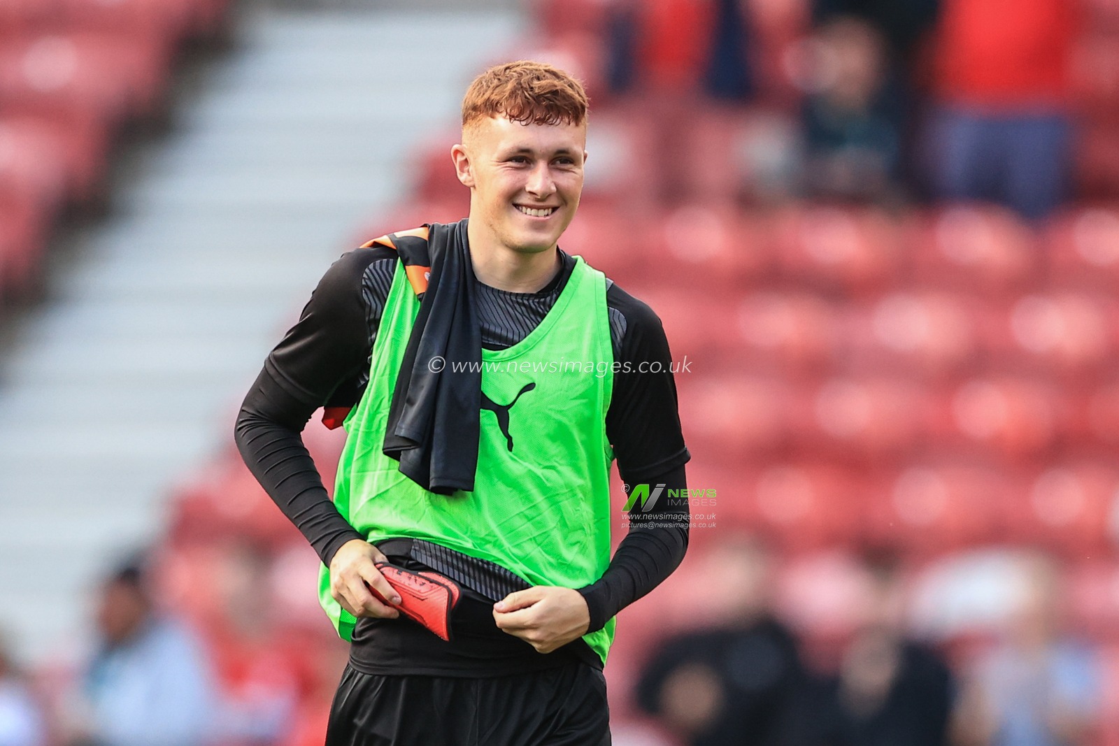 Sonny Carey #16 of Blackpool is full of smiles as he walks over to the fans as Blackpool win 1-2