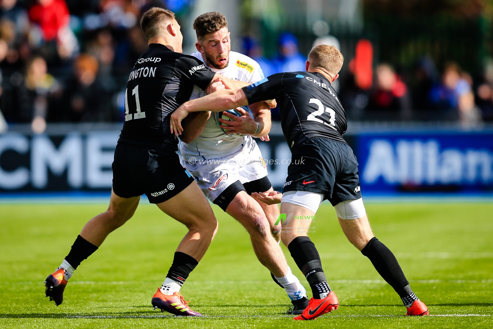 4th May 2019 , Allianz Park , London, England; Gallagher Premiership, Saracens vs Exeter Chiefs ; Alex Cuthbert (11) of Exeter receives a tackle from Alex Lewington (11) and Tom Whiteley (21) of Saracens

Credit: Georgie Kerr/News Images