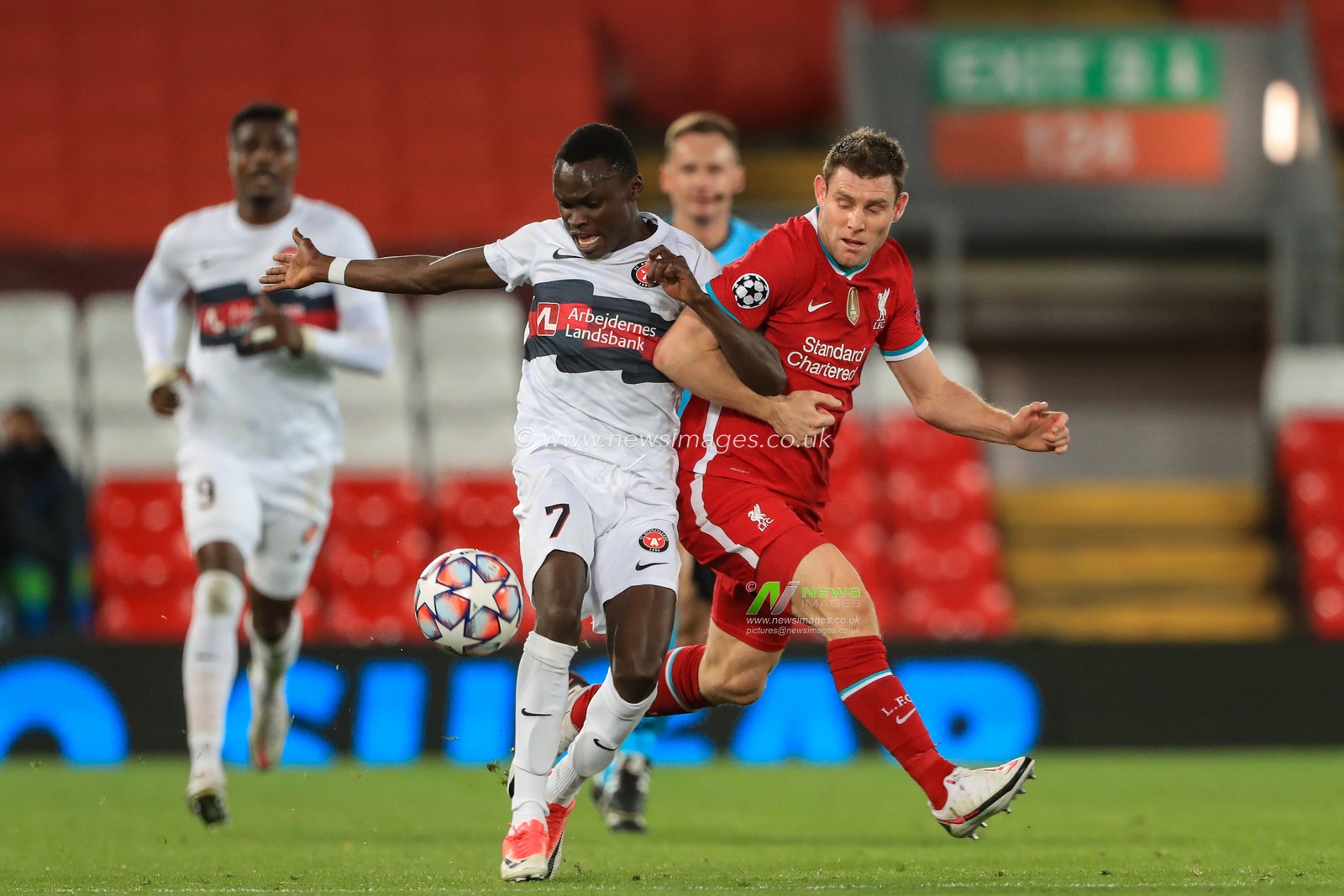 James Milner (7) of Liverpool fowls Pione Sisto (7) of FC Midtjylland