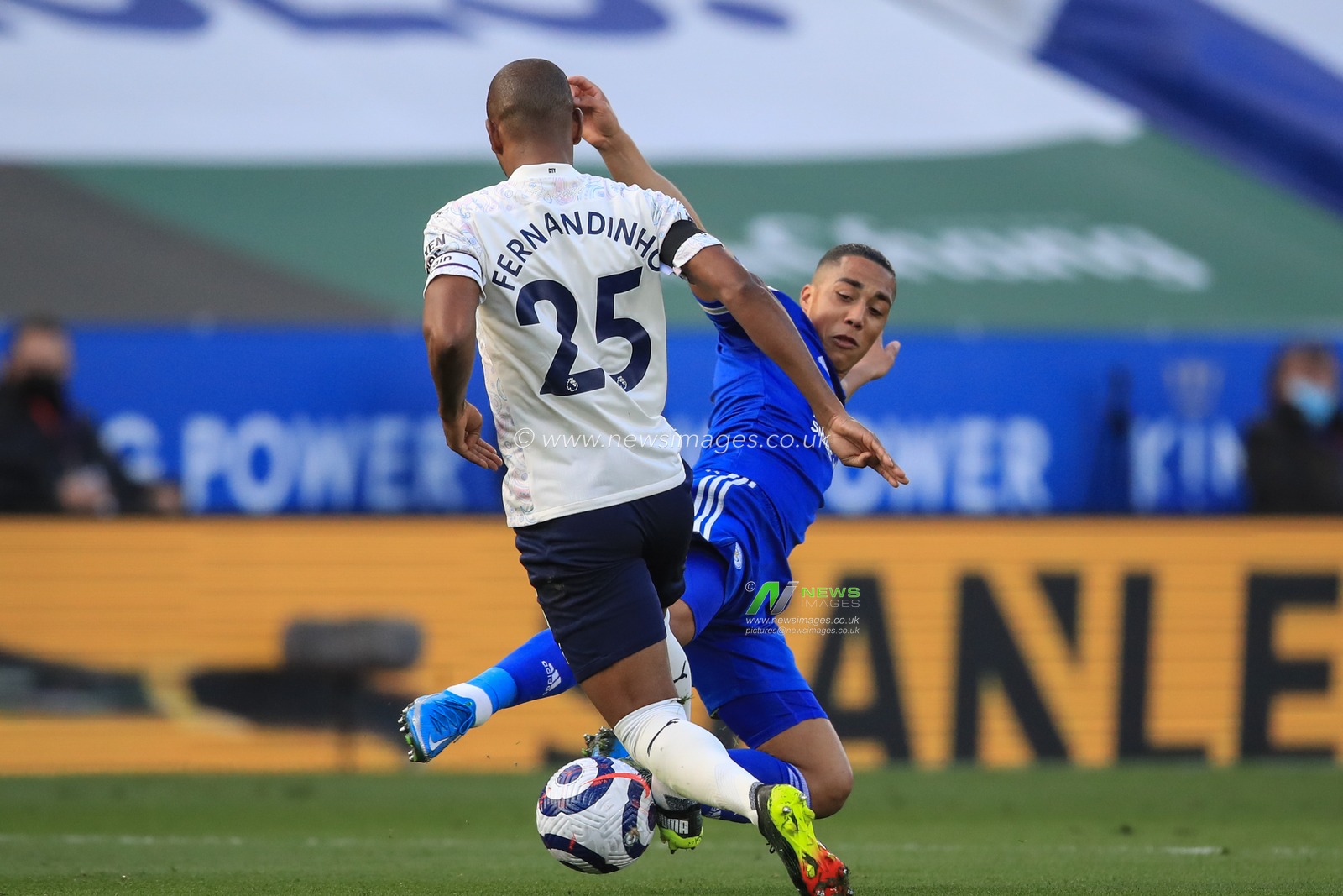 Youri Tielemans #8 of Leicester City and Fernandinho #25 of Manchester City battle for the ball