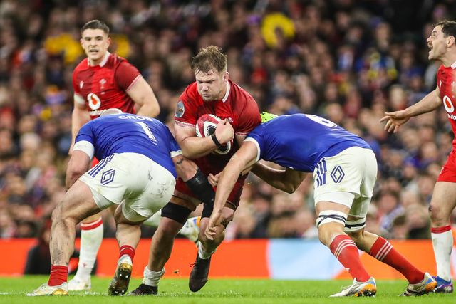 Olly Cracknell of Wales is tackled during the Guinness Six Nations match Wales vs France at Principality Stadium, Cardiff, United Kingdom, 15th February 2026

(Photo by Andrew Lewis/News Images)