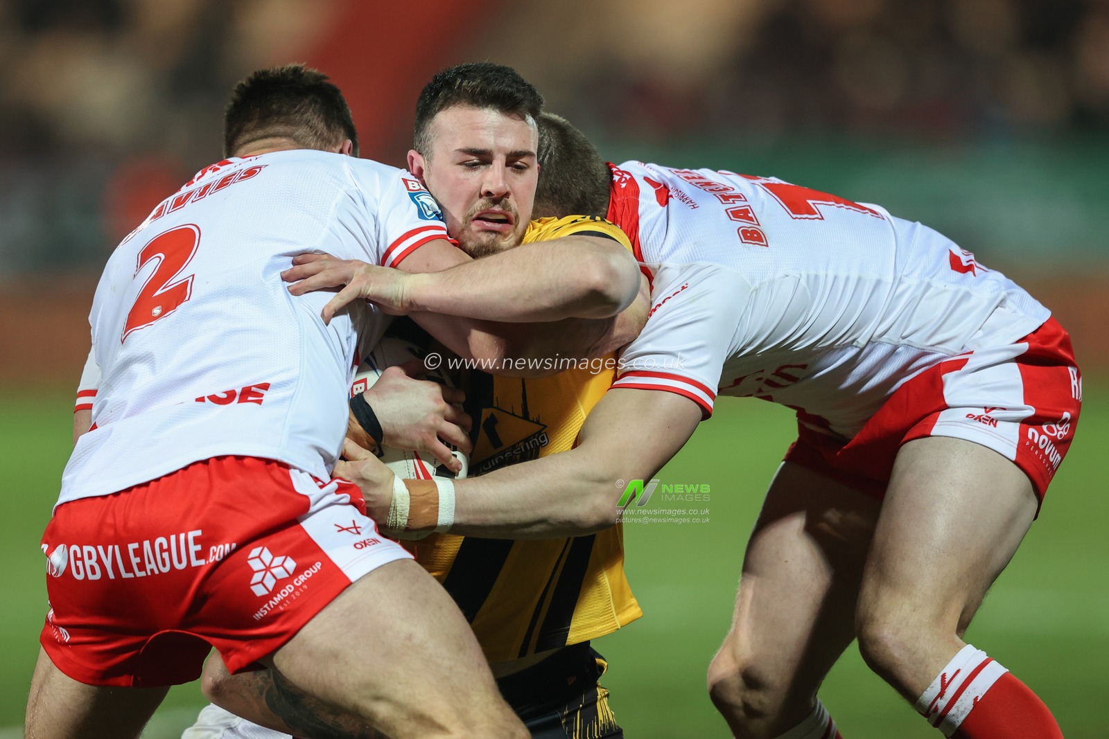 Josh Hodson of Castleford Tigers is tackled by Tom Davies of Hull KR and James Batchelor of Hull KR during the Betfred Super League Round 1 match Hull KR vs Castleford Tigers at Sewell Group Craven Park, Kingston upon Hull, United Kingdom, 14th February 2025

(Photo by Alfie Cosgrove/News Images)