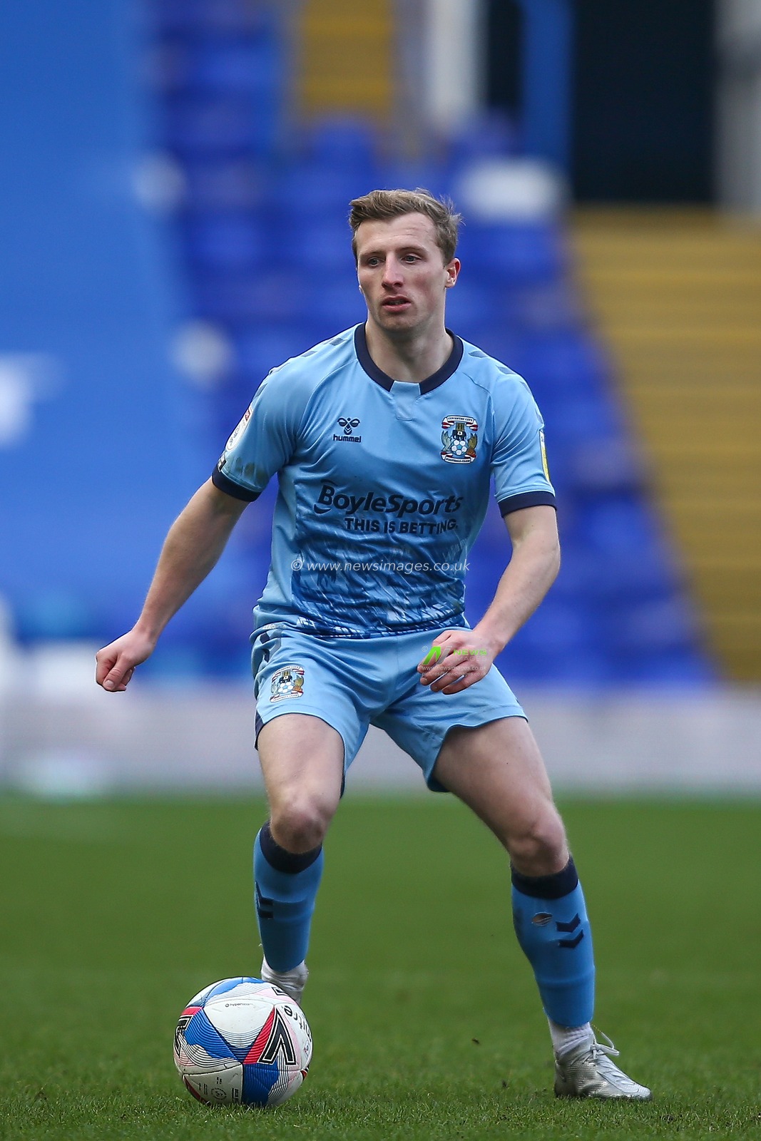 Jamie Allen #8 of Coventry City dribbles the ball