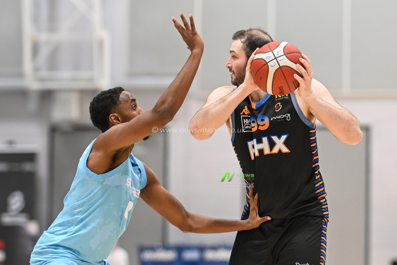 Skyler White of Cheshire Phoenix under pressure from Abdul Mohamed of Surrey Scorchers during the British Basketball Championship match Cheshire Phoenix vs Surrey Scorchers at Ellesmere Port Sports Village, Ellesmere Port, United Kingdom, 19th November 2023

(Photo by Craig Thomas/News Images)