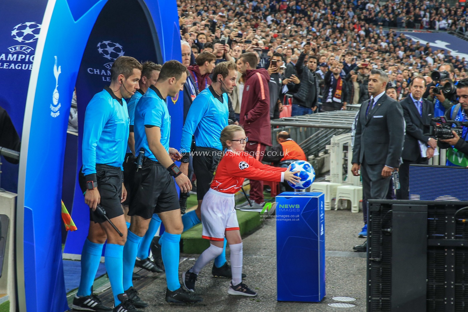 3rd October 2018, Wembley Stadium, London, England; UEFA Champions League, Tottenham v Barcelona ; The games mascot collects the match ball 

Credit: Mark Cosgrove/News Images