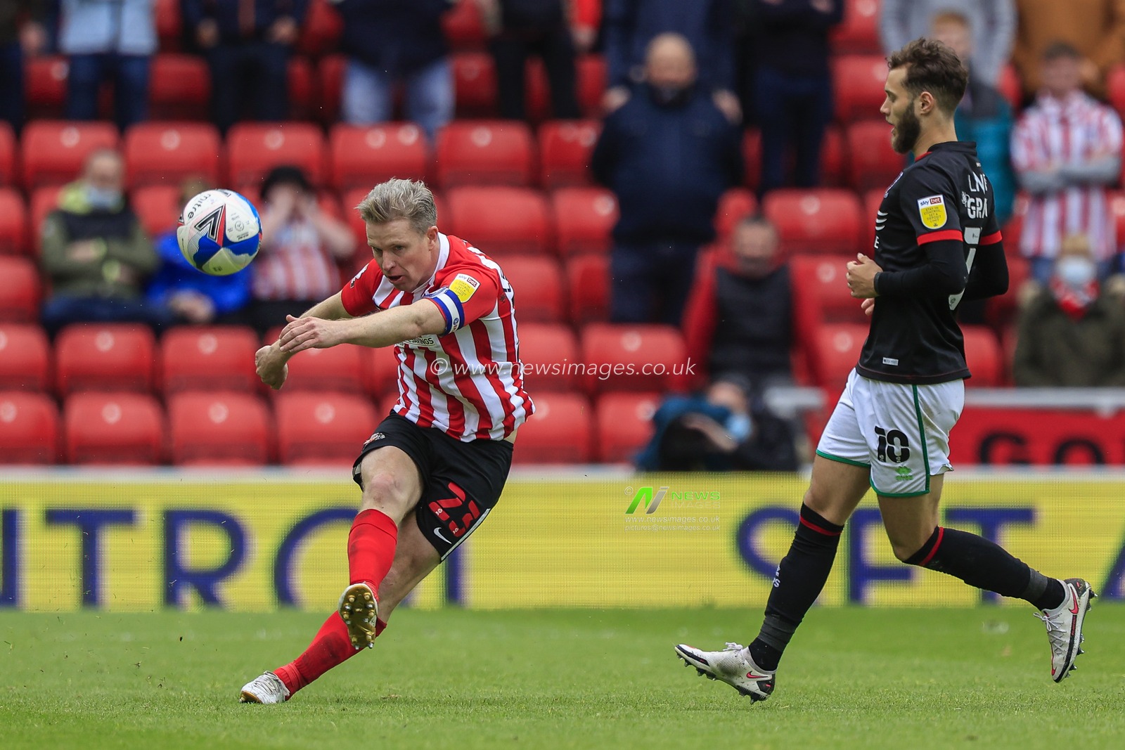 Grant Leadbitter #23 of Sunderland plays a long ball upfield
