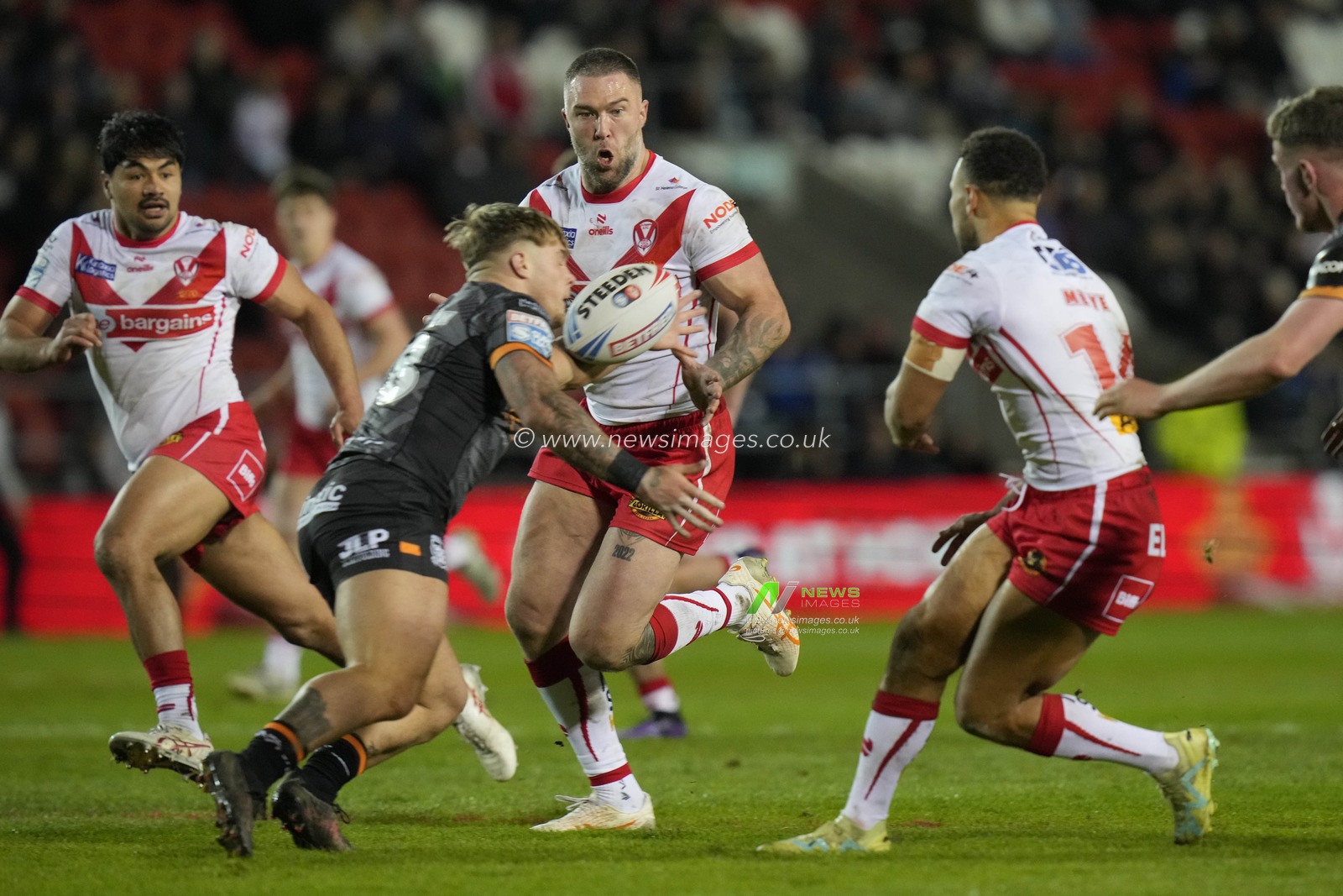 Denive Balmforth of Hull FC blocks a pass to Curtis Sironen of St. Helens during the Betfred Super League  Round 8 match St Helens vs Hull FC at Totally Wicked Stadium, St Helens, United Kingdom, 19th April 2024

(Photo by Steve Flynn/News Images)