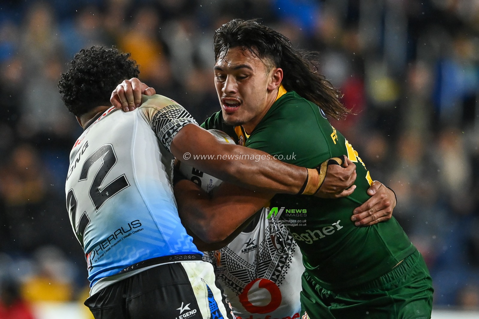 Tino Fa'asuamaleaui of Australia is tackled by Josh Wong of Fiji during the Rugby League World Cup 2021 match Australia vs Fiji at Headingley Stadium, Leeds, United Kingdom, 15th October 2022

(Photo by Craig Thomas/News Images)