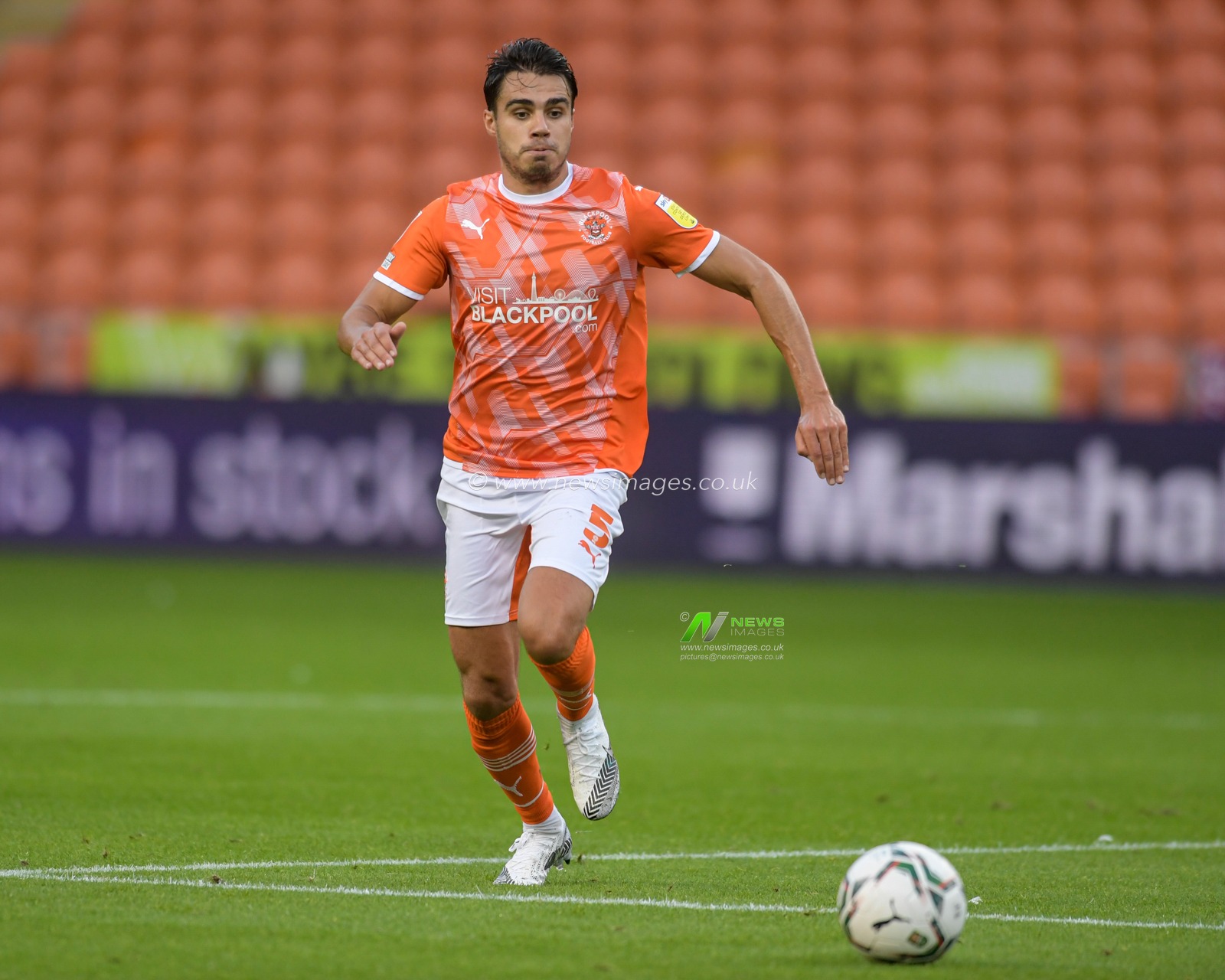 Reece James #5 of Blackpool chases the ball