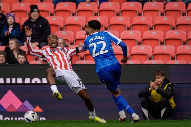 Eric Bocat of Stoke City is tackled by  Gabriel Otegbayo of Sheffield Wednesday during the Sky Bet Championship match Stoke City vs Sheffield Wednesday at Bet365 Stadium, Stoke On Trent, United Kingdom on 03 April 2026

(Photo by Maynard Manyowa/News Images)