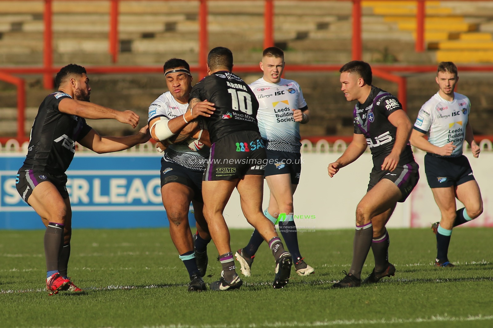 Ava Seumanufagai (8) of Leeds Rhinos on the attack against Wakefield Trinity Tinirau Arona (10).