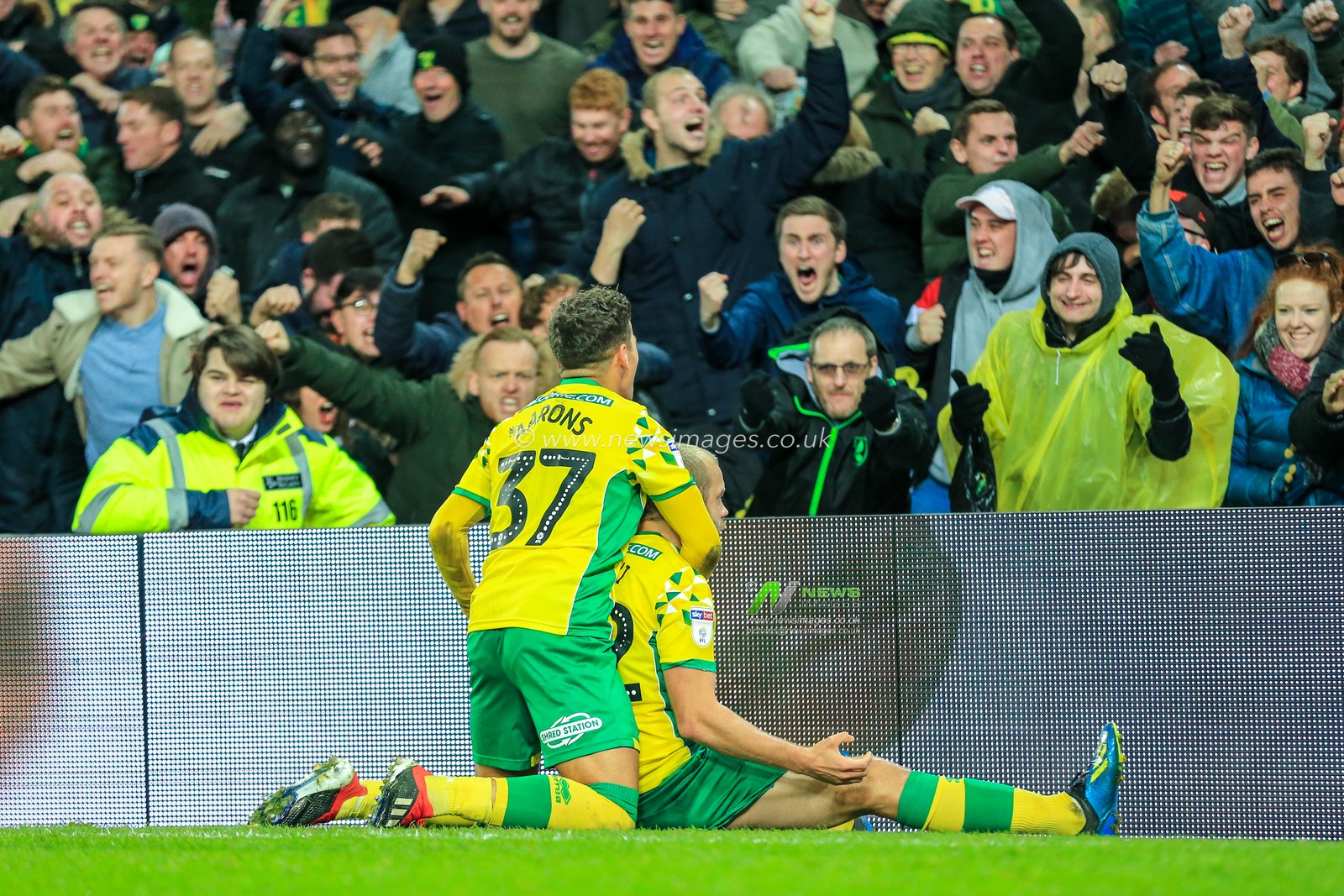 8th December 2018, Carrow Road, Norfolk, England; Sky Bet Championship, Norwich City v Bolton Wonderers ;  Teemu Pukki (22) of Norwich City celebrates his winning goal in front of the Norwich fans with Max Aarons.

Credit: Georgie Kerr/News Images

English Football League images are subject to DataCo Licence