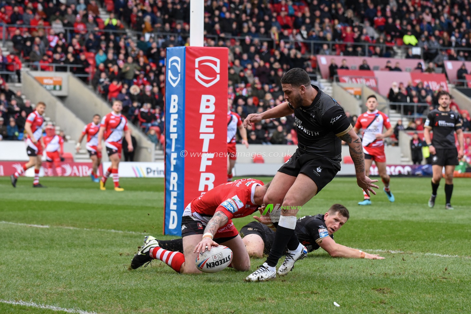 8th February 2020, AJ Bell Stadium, Eccles, England; Betfred Super League, Salford Red Devils v Toronto Wolfpack : Kevin Brown (31) of Salford Red Devils goes over for a try