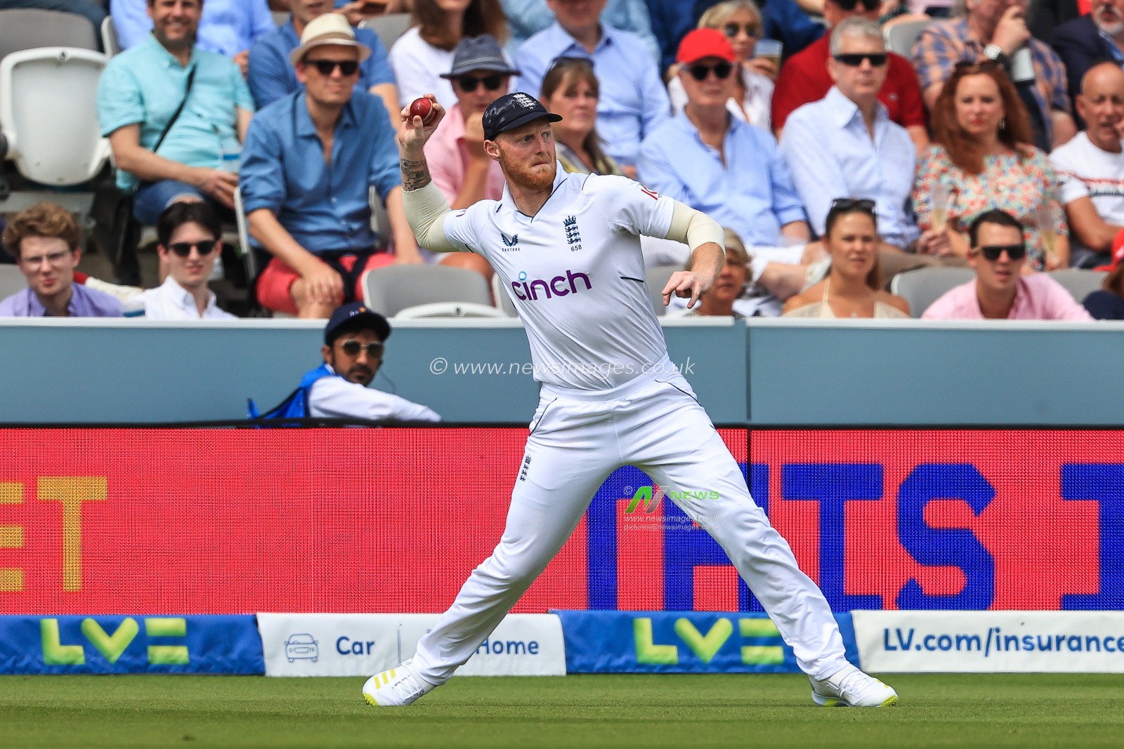 Ben Stokes of England throws the ball back