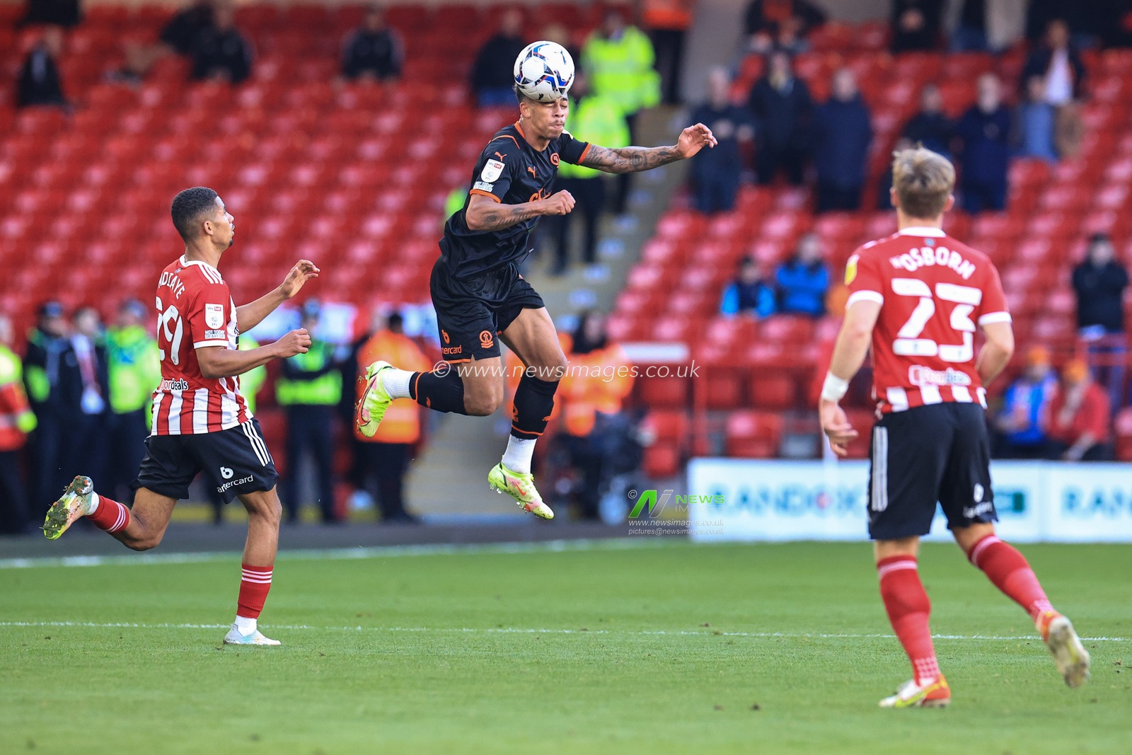 Jordan Gabriel #4 of Blackpool heads the ball