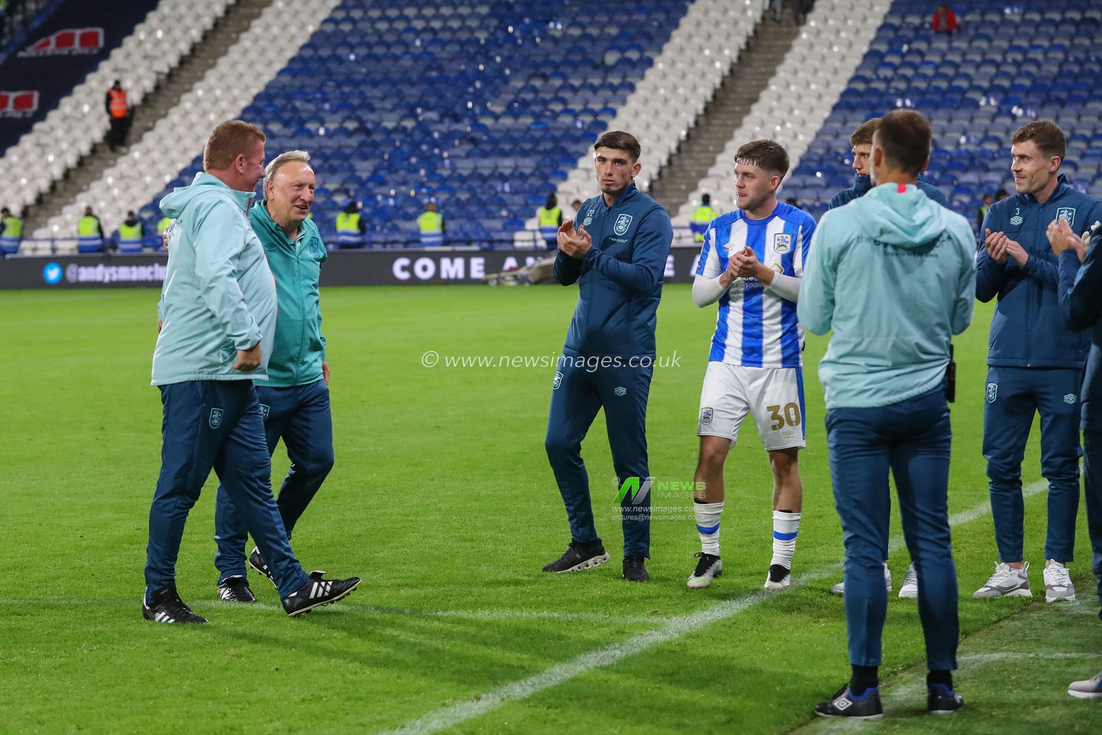 Huddersfield Town players and staff give Neil Warnock manager of Huddersfield Town and Ronnie Jepson assistant manager of Huddersfield Town a guard of honour after the Sky Bet Championship match Huddersfield Town vs Stoke City at John Smith's Stadium, Huddersfield, United Kingdom, 20th September 2023

(Photo by Gareth Evans/News Images)