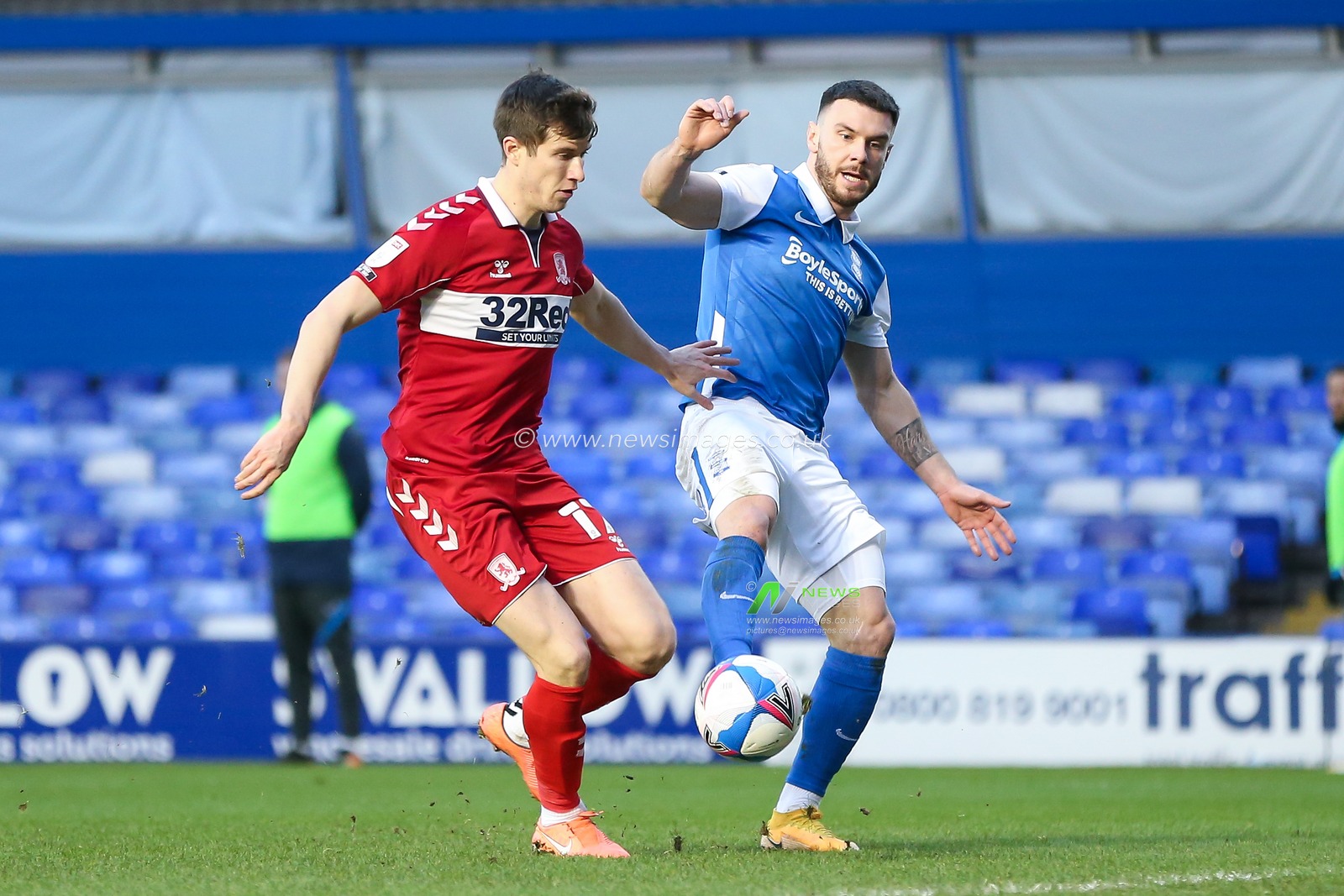 Scott Hogan #9 of Birmingham City and Paddy McNair #17 of Middlesbrough challenge for the ball